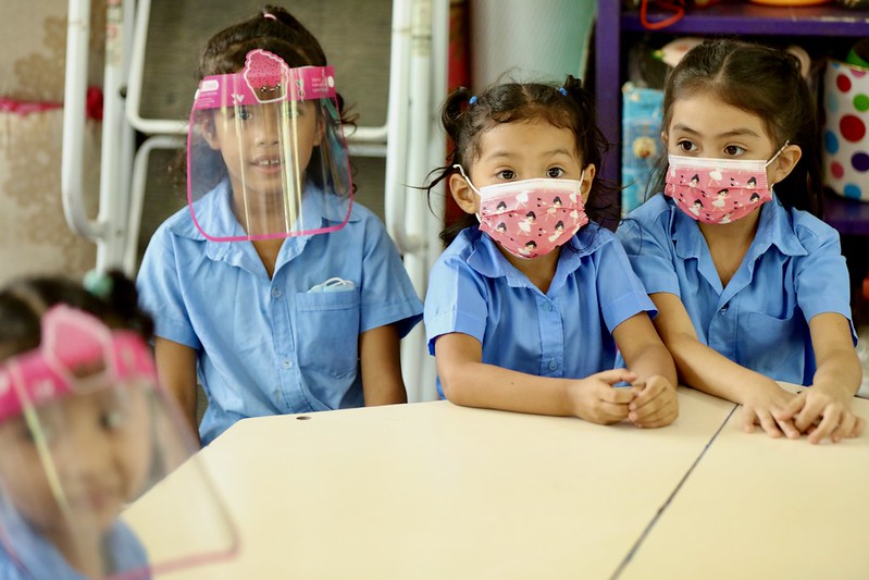 El Salvador children in surgical masks and face shields