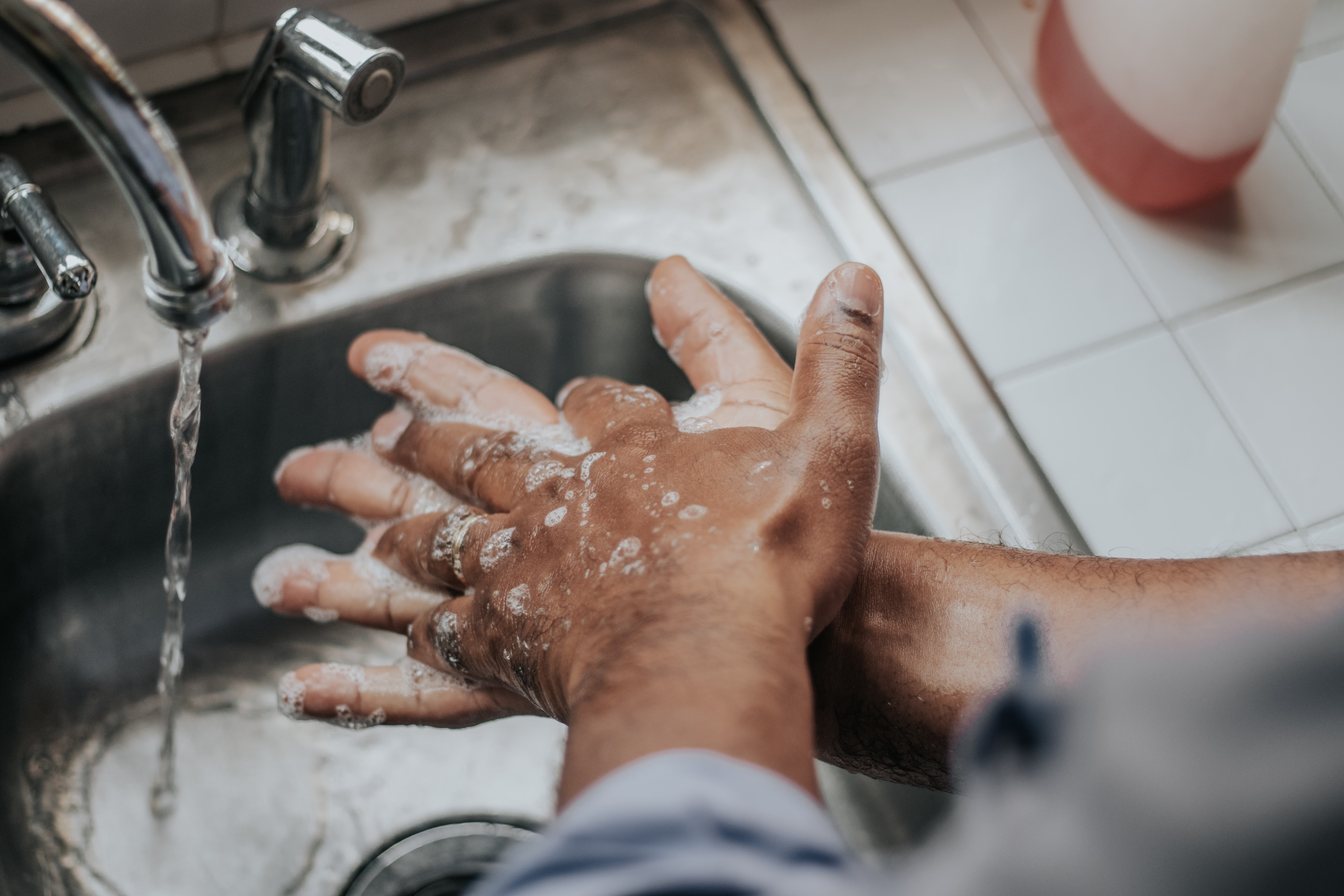 Person washing their hands, Haiti